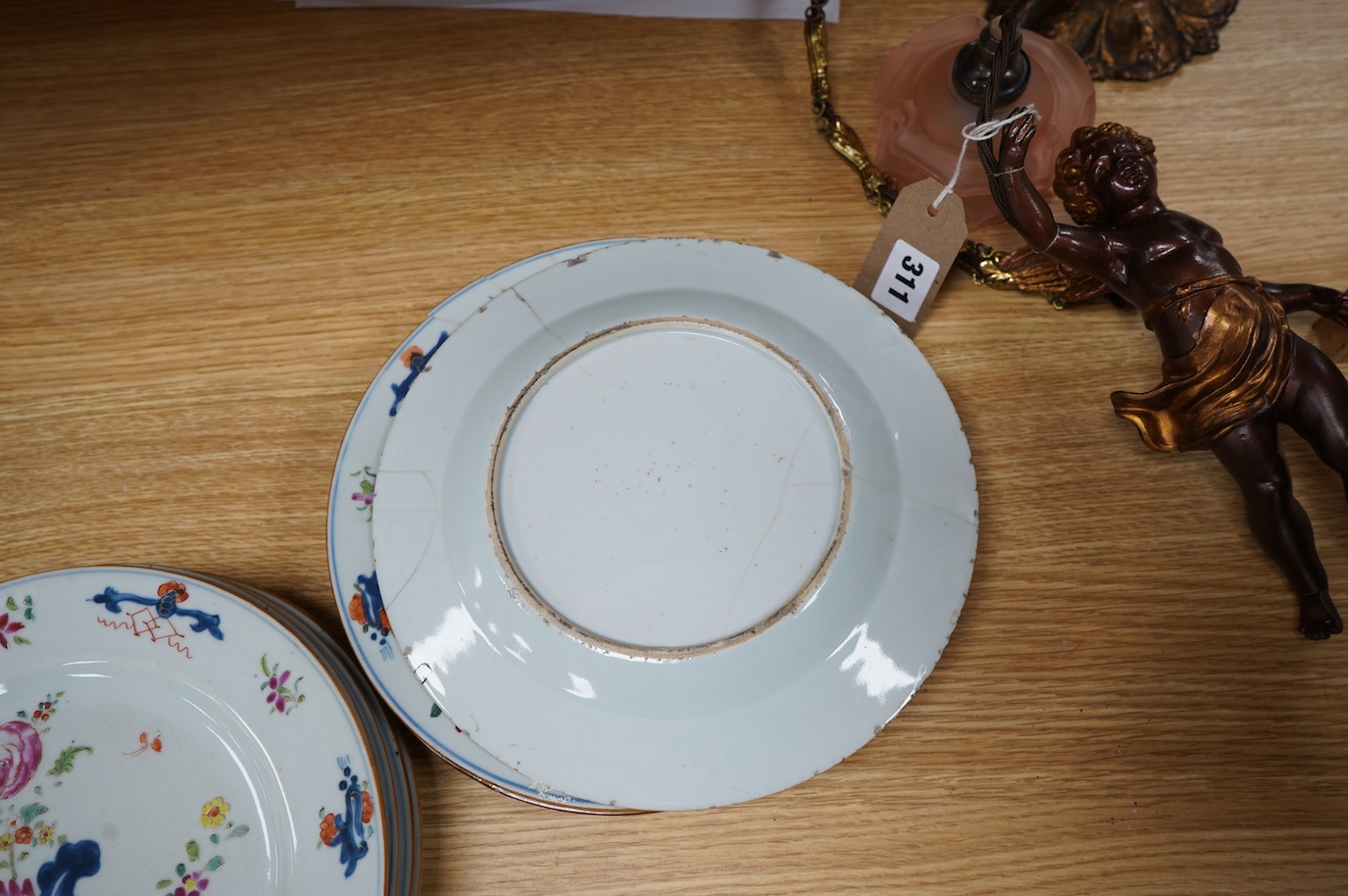 A set of eleven Chinese porcelain ‘’tobacco leaf’’ dishes, (3 cracked), 23cm diameter. Condition - poor.